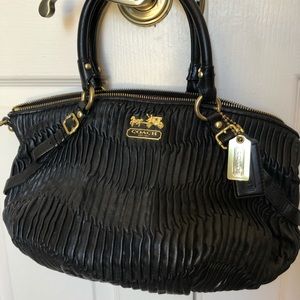 Black coach purse with violet lining.  I am